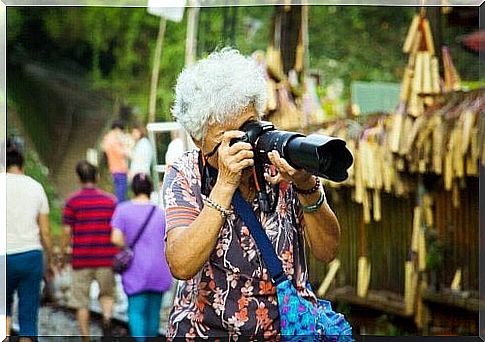 Elderly woman taking a photo