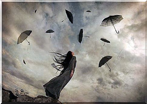 woman looking umbrellas flying