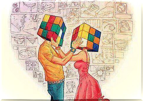 couple with rubik's cube on their head