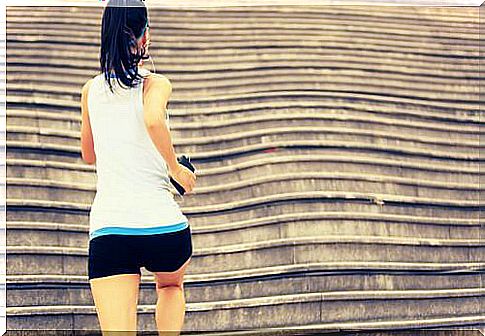 Girl climbing stairs while doing sports enjoy free time