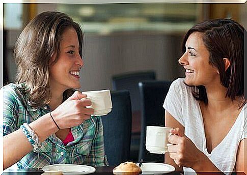 Girlfriends drinking coffee together