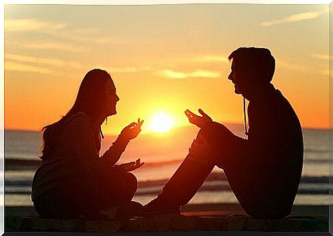 Young people conversing at sunset