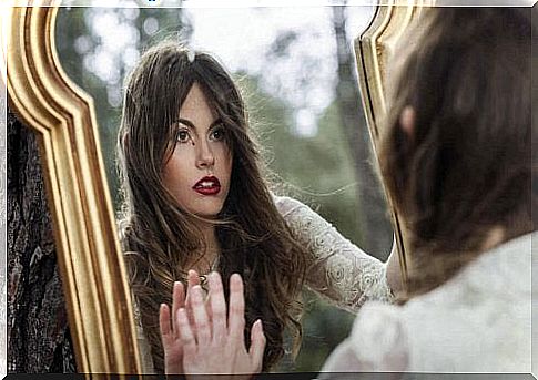 girl looking in the mirror