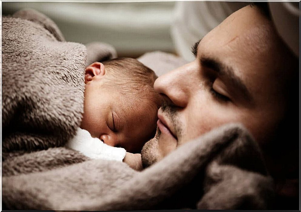 Man with newborn