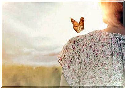 Butterfly on a woman's shoulder.