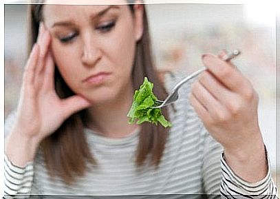 Girl who is not convinced of the origin of her salad