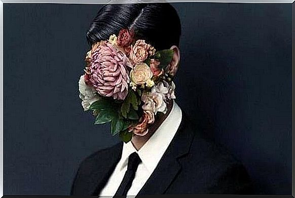 Person with face covered with flowers