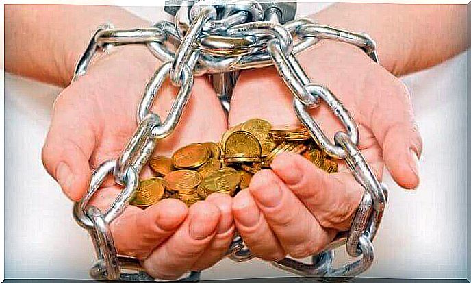 Hands chained with money