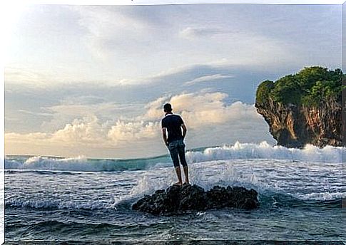 Boy on a rock brooding