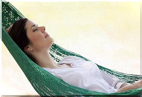 Woman sleeping in a hammock