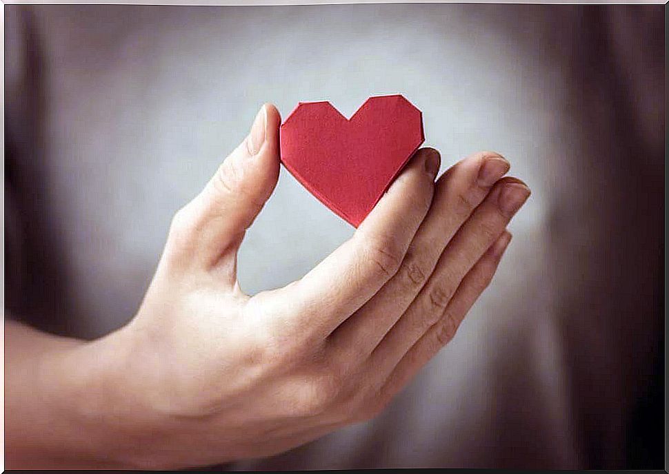 Paper heart in hand 1