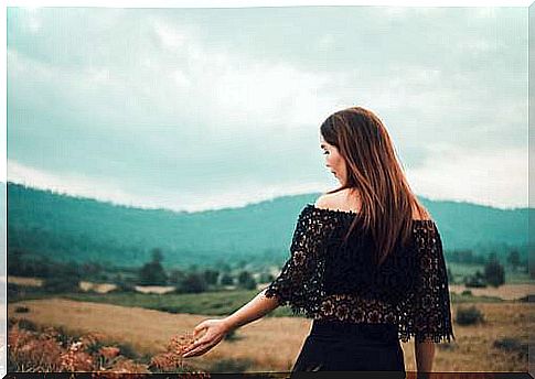 Woman in the autumn countryside